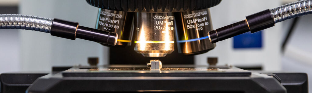 Microscope used for detailed inspection and analysis of materials, surfaces, and packaging components at a microscopic level.