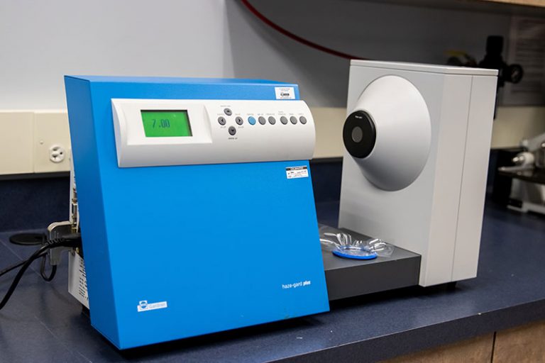 Haze meter testing equipment used to measure the clarity and optical properties of packaging materials.